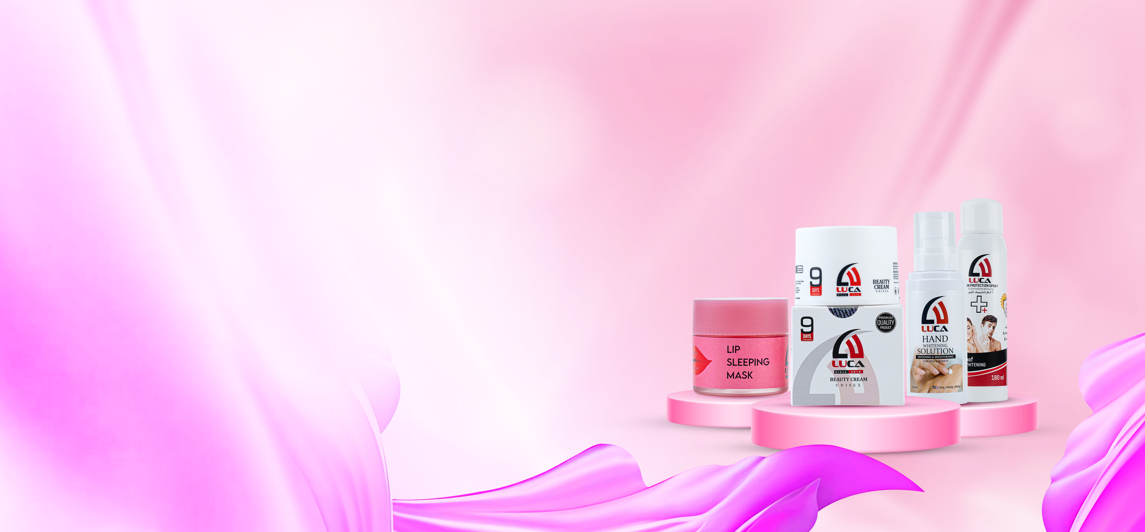 Set of skincare products on a pink background